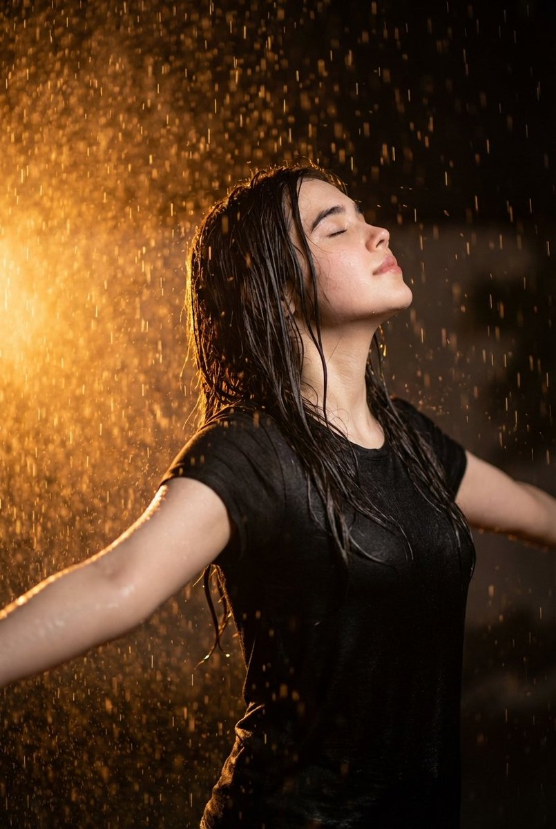 Cinematic portrait of woman in heavy rain at night 1