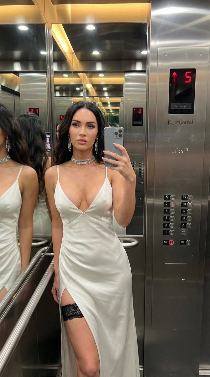 Luxury Elevator Mirror Selfie in Deep V-Neck Dress 3