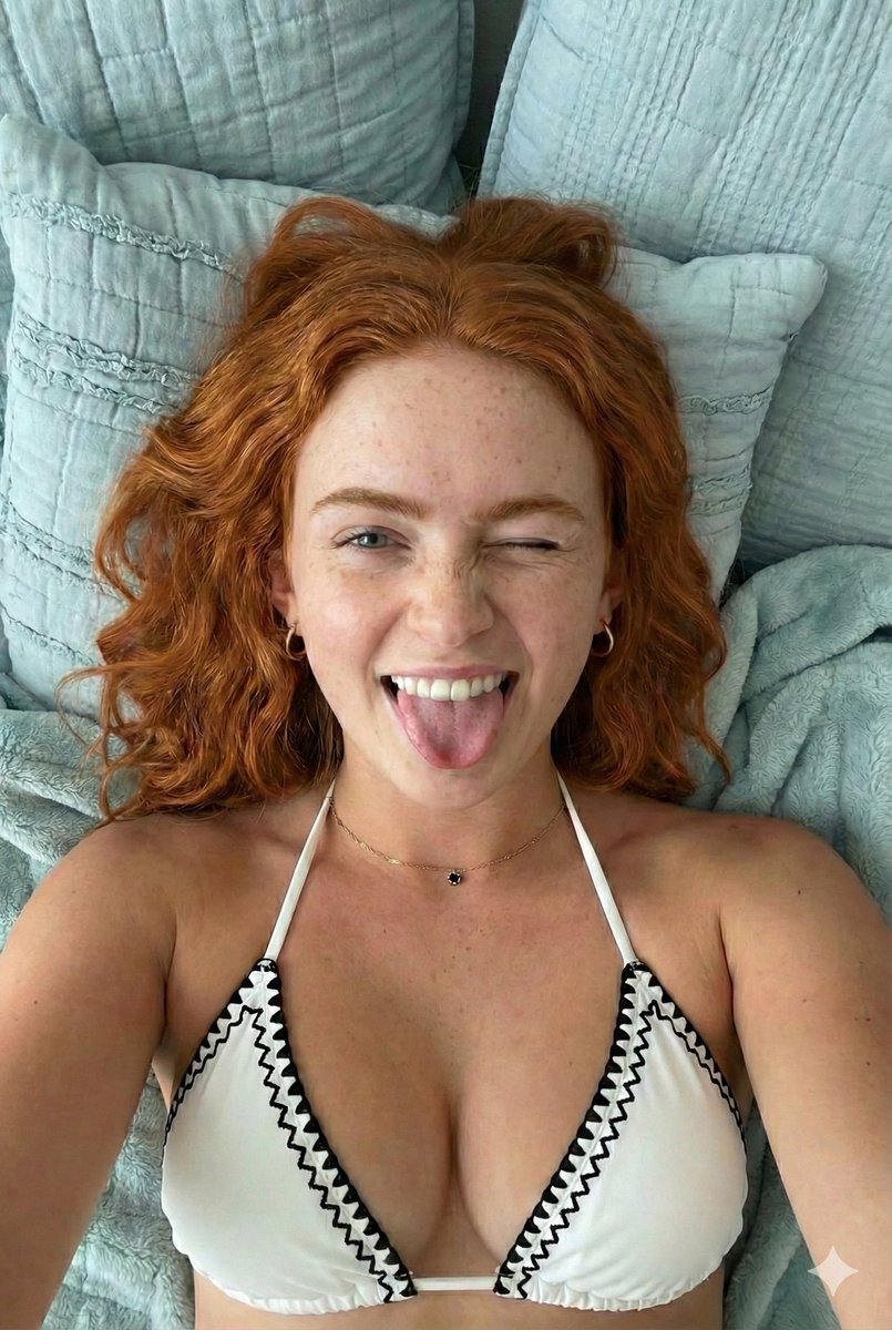 Close-up Portrait of a Playful Young Woman Lying Down 2