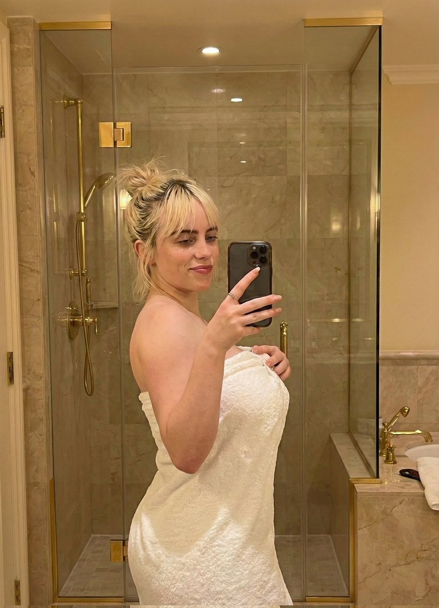 Sabrina Carpenter Mirror Selfie in a Luxurious Marble Bathroom 2